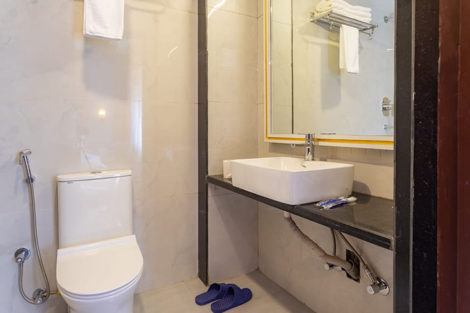 Deluxe Double or Twin Room, 1 Bedroom | Bathroom | Shower, rainfall showerhead, hair dryer, bathrobes