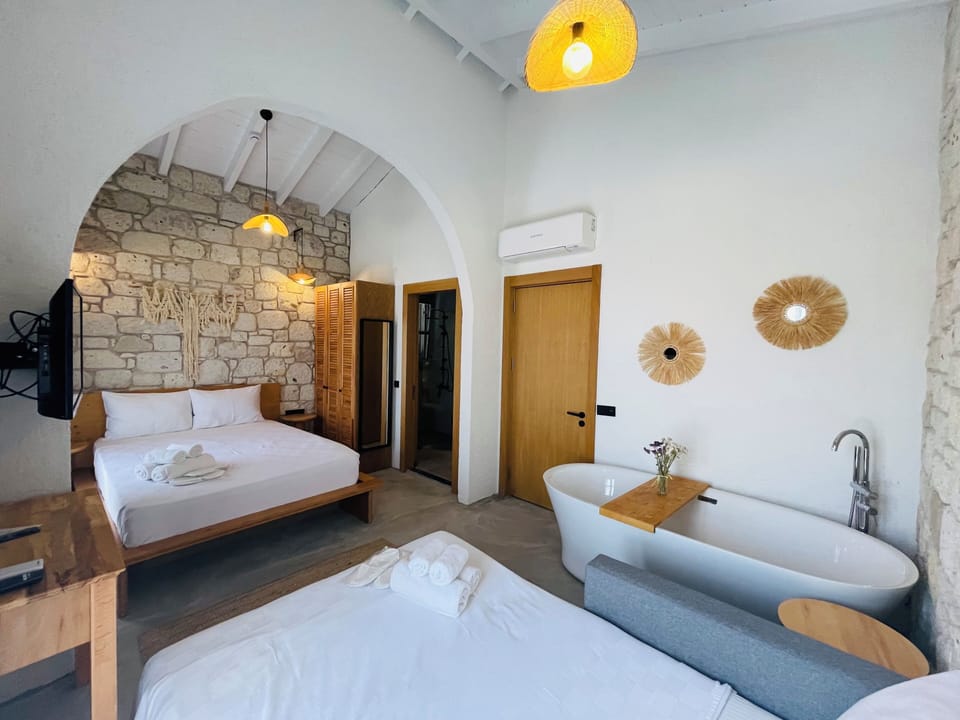 Exclusive Quadruple Room, 1 Bedroom, Bathtub, Pool View | Egyptian cotton sheets, premium bedding, memory foam beds, in-room safe