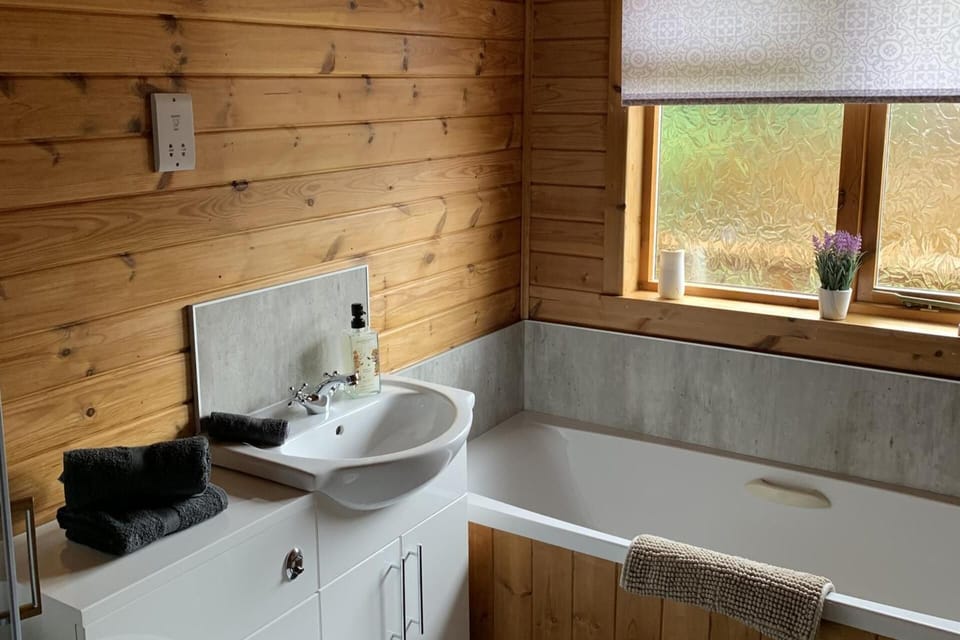 Separate tub and shower, deep soaking tub, hair dryer, towels