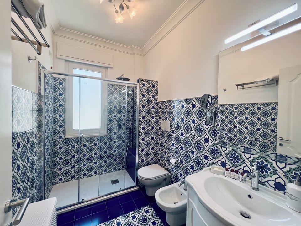 Luxury Room, 2 Bedrooms | Bathroom | Shower, free toiletries, hair dryer, bidet