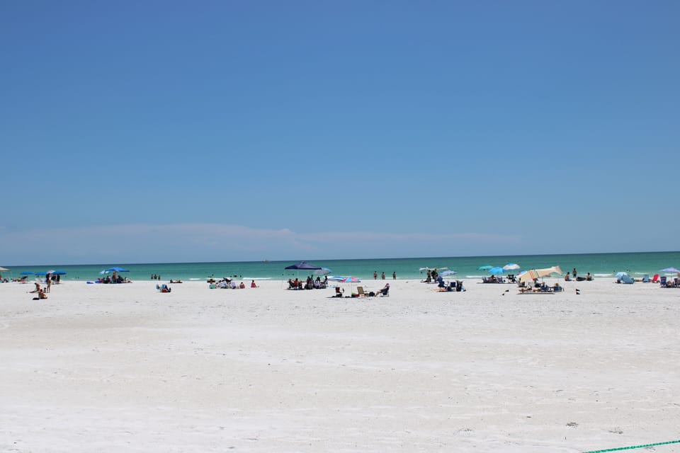 Beach nearby, white sand, beach towels