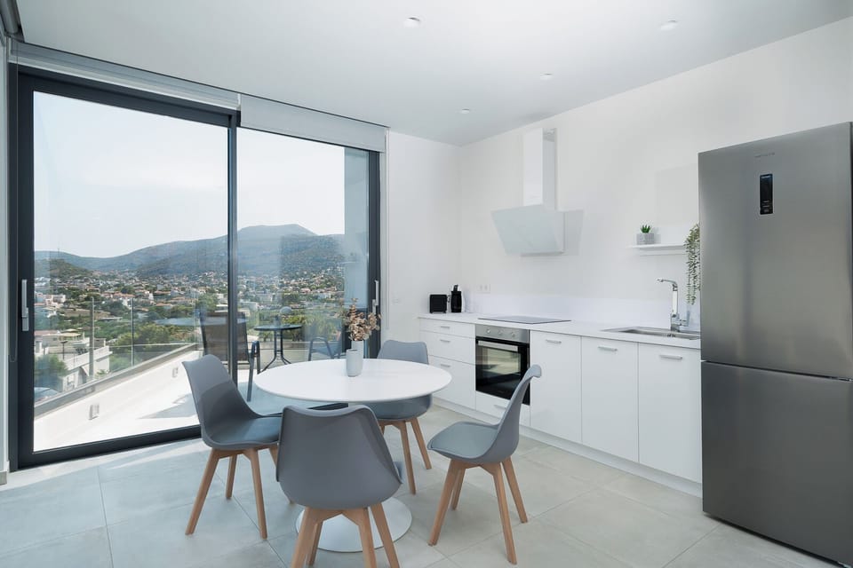 Luxury Suite | Private kitchen | Full-size fridge, oven, stovetop, electric kettle