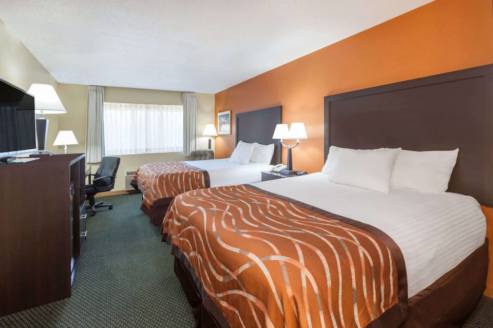 Standard Room, 2 Queen Beds, Non Smoking | Desk, blackout drapes, iron/ironing board, free cribs/infant beds
