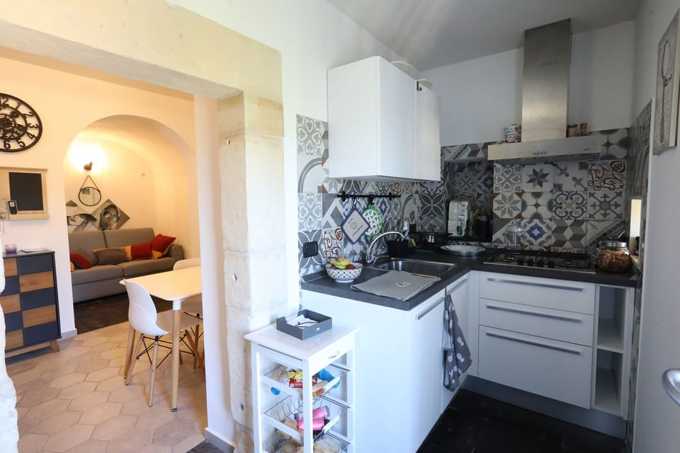 Full-size fridge, toaster, cookware/dishes/utensils, freezer