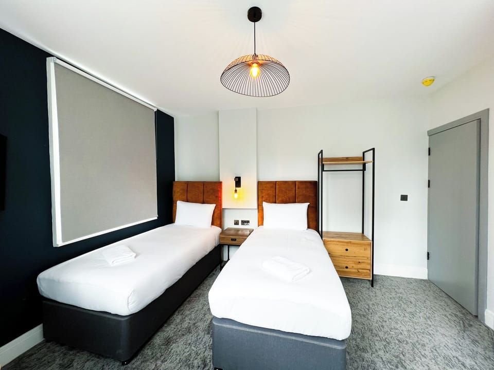 Quadruple Room | Desk, iron/ironing board (on request), WiFi (free), bed sheets