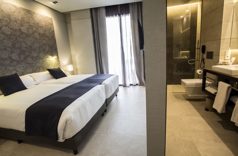 Premium bedding, down comforters, minibar, in-room safe