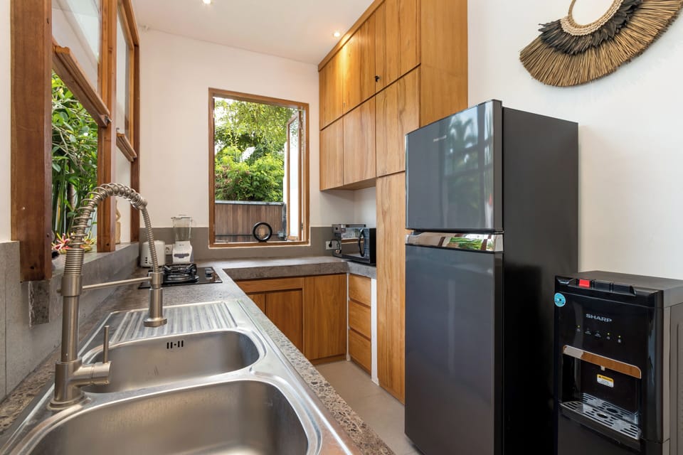 Villa | Private kitchen | Fridge, microwave, toaster, cookware/dishes/utensils