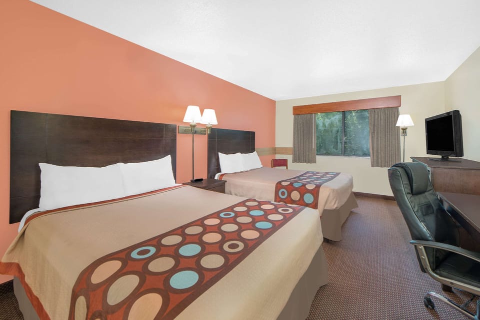 Desk, blackout drapes, iron/ironing board, free cribs/infant beds