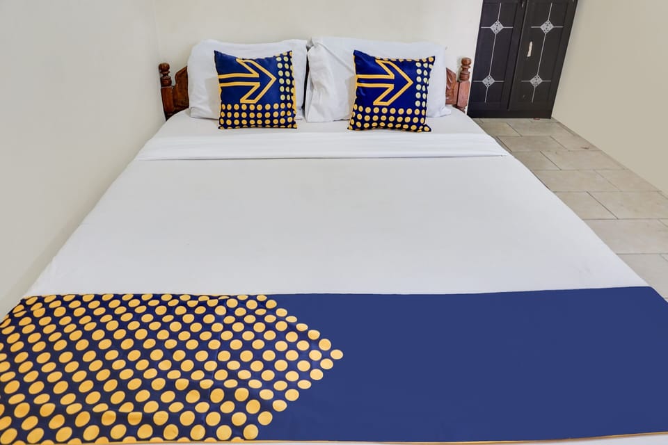 Laptop workspace, bed sheets