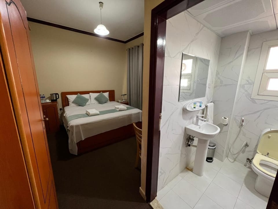 Shower, free toiletries, slippers, towels