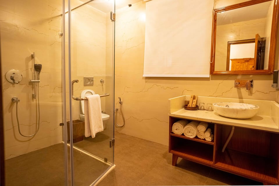 Shower, rainfall showerhead, designer toiletries, slippers