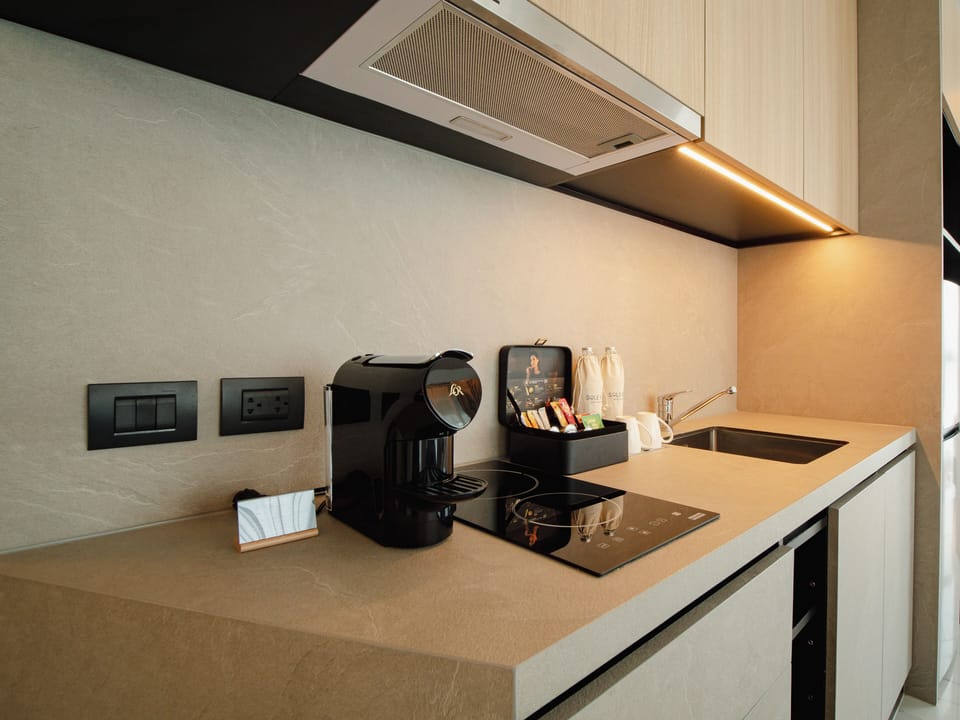 One-Bedroom Suite | Private kitchen | Fridge, microwave, cookware/dishes/utensils, cleaning supplies