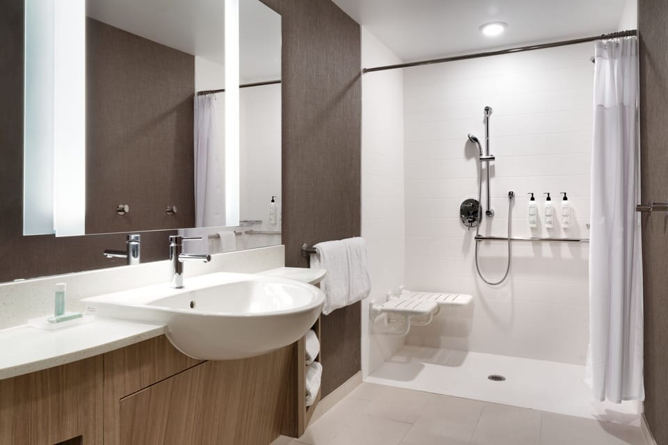 Designer toiletries, hair dryer, towels, soap