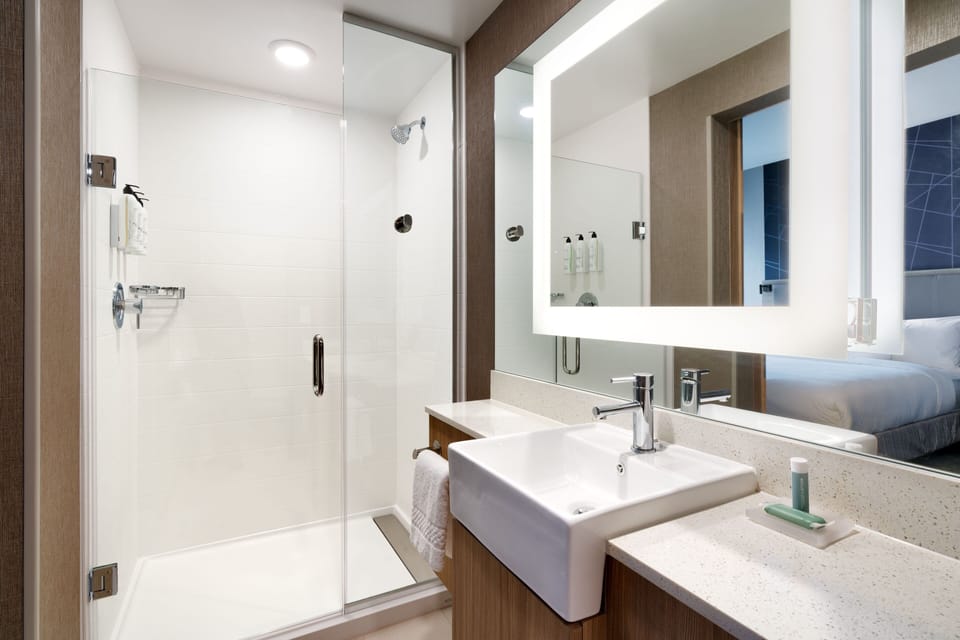 Designer toiletries, hair dryer, towels, soap