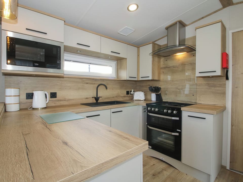 Fridge, electric kettle, toaster, cookware/dishes/utensils