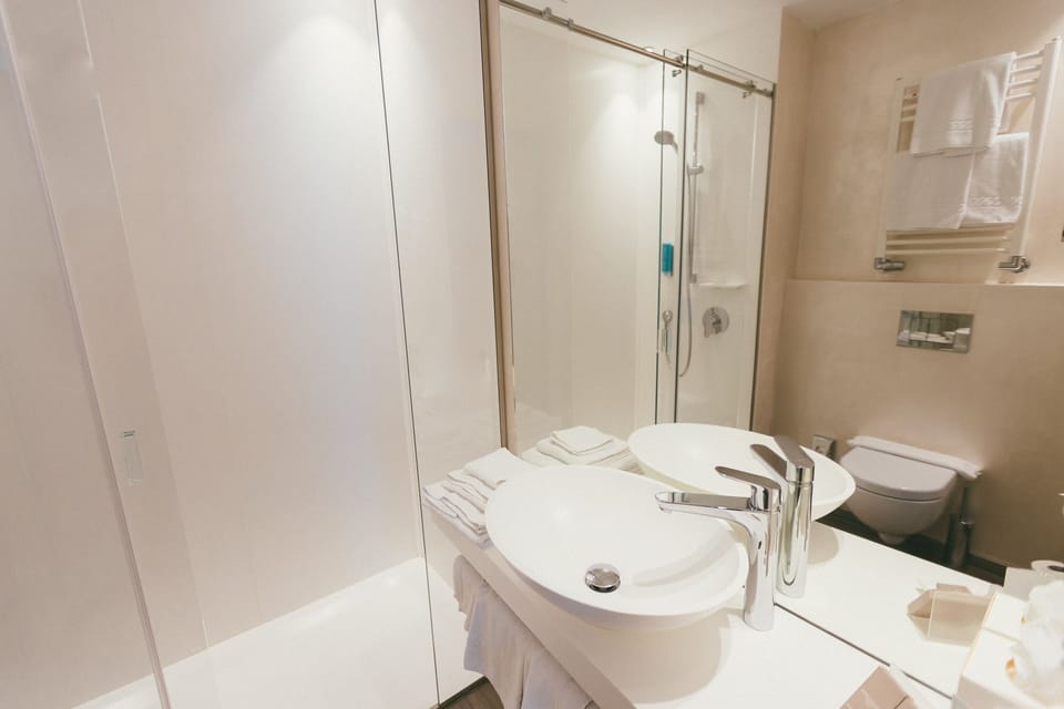 Shower, free toiletries, slippers, towels