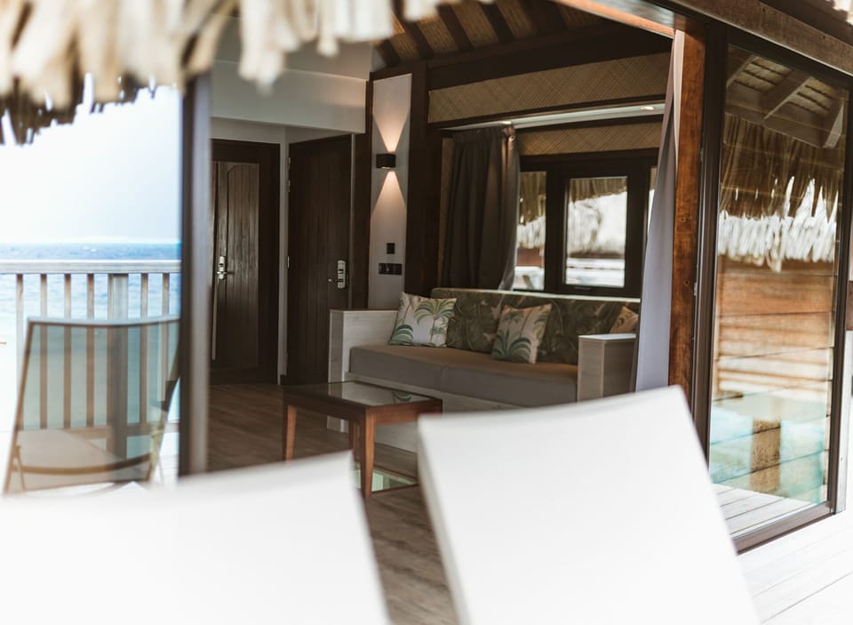 Premium Overwater Bungalow | Living area | Flat-screen TV