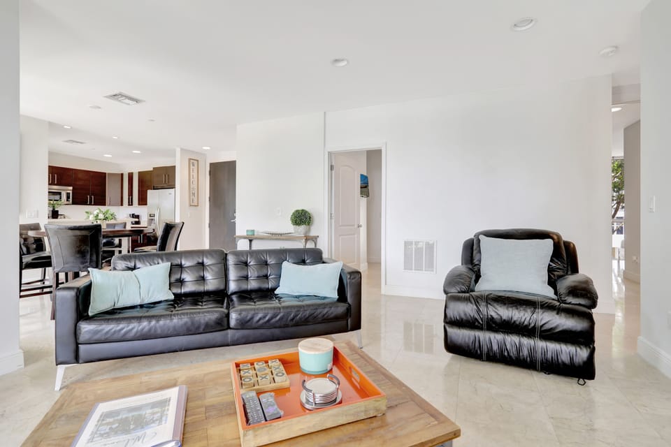 Deluxe Condo | Living area | 65-inch Smart TV with digital channels