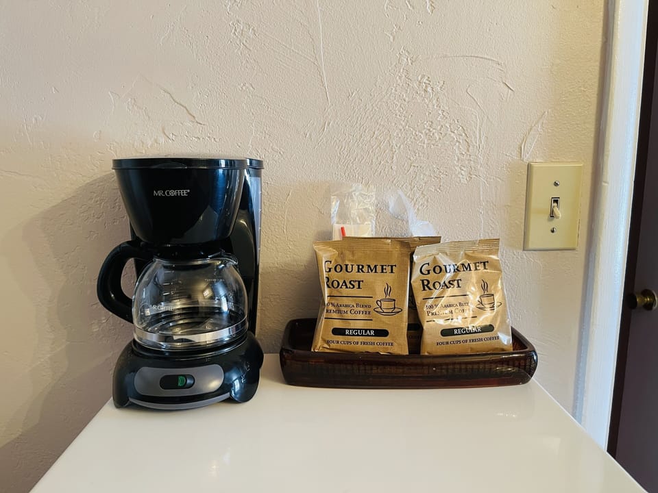 Desk, blackout drapes, iron/ironing board, free wired internet