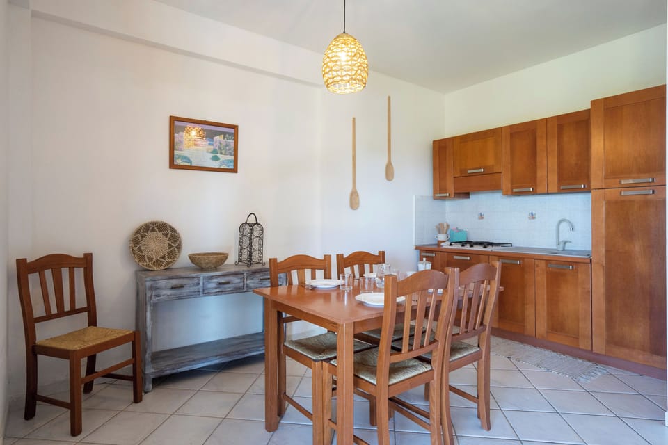 Deluxe Apartment, 2 Bedrooms, Terrace, Sea View | Private kitchen | Full-size fridge, coffee/tea maker, cookware/dishes/utensils