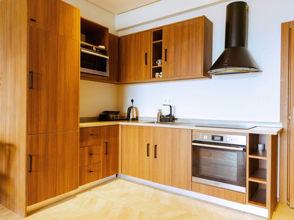 Deluxe Apartment, 2 Bedrooms, Balcony, Sea View | Private kitchen | Espresso maker, coffee/tea maker, full-size fridge, microwave