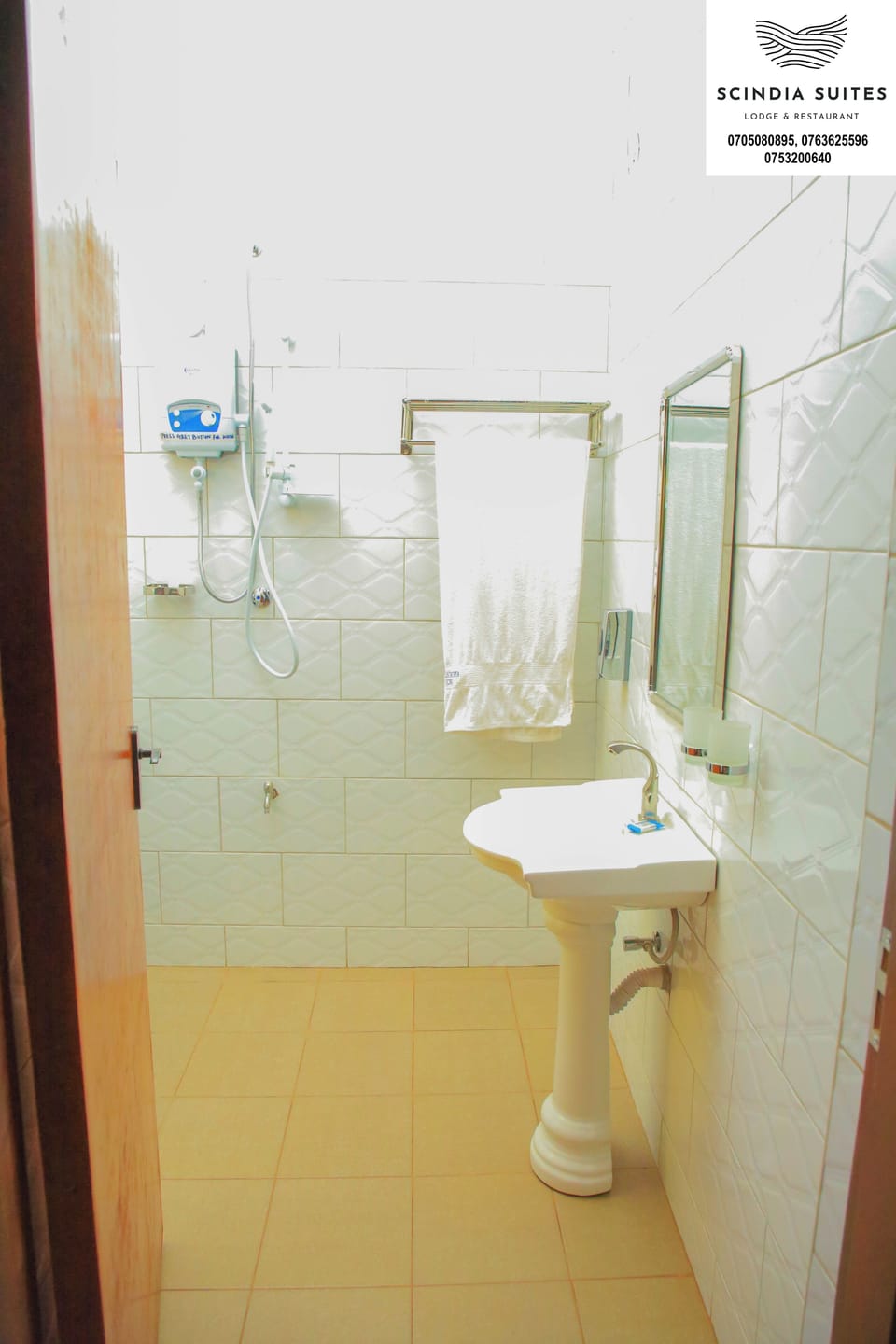 Shower, rainfall showerhead, slippers, towels