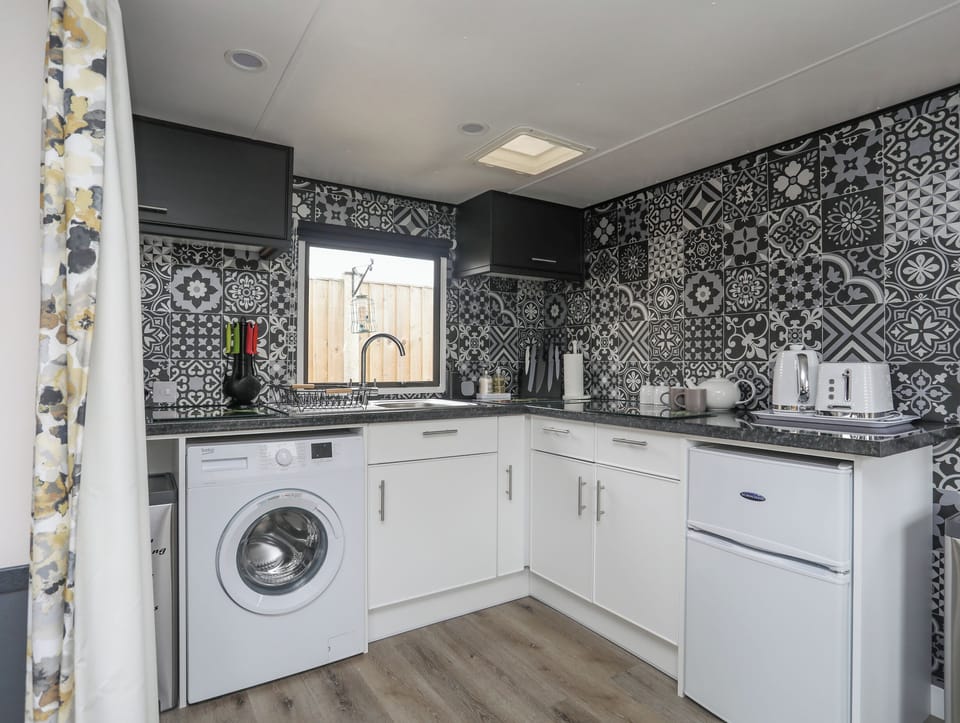 Fridge, electric kettle, cookware/dishes/utensils