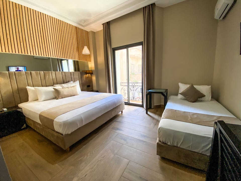 Comfort Quadruple Room | Premium bedding, individually furnished, desk, laptop workspace