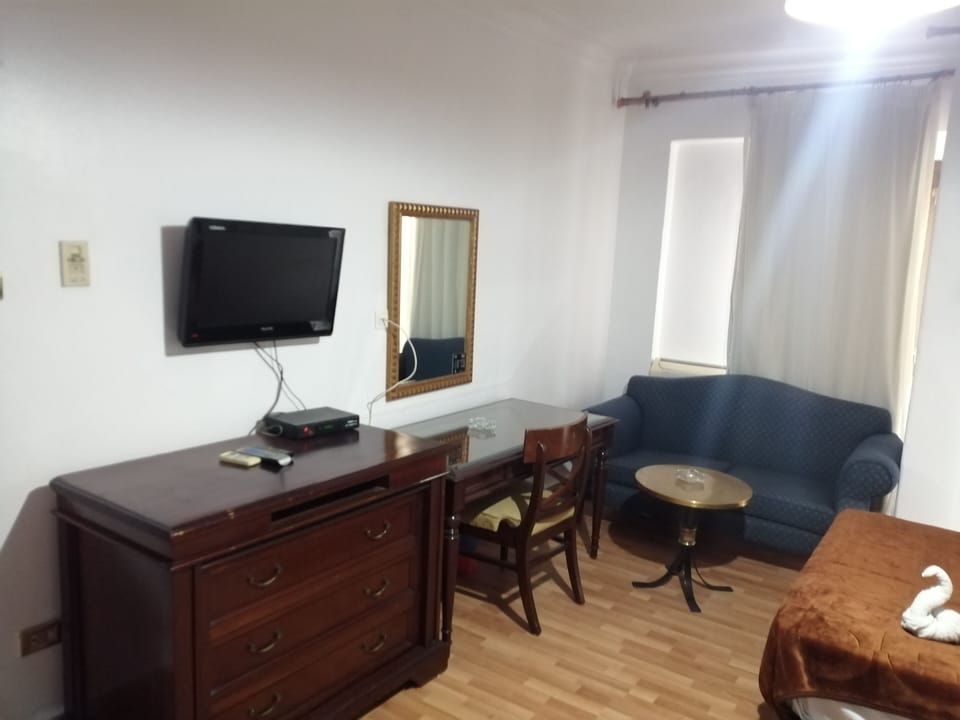 32-inch flat-screen TV with satellite channels, TV