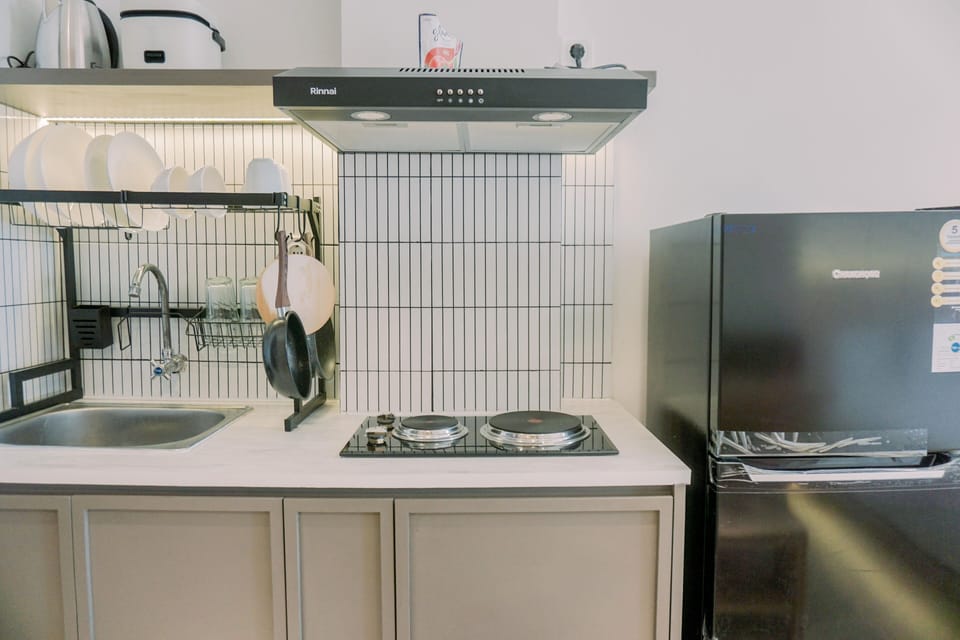 Full-size fridge, stovetop, rice cooker, cookware/dishes/utensils