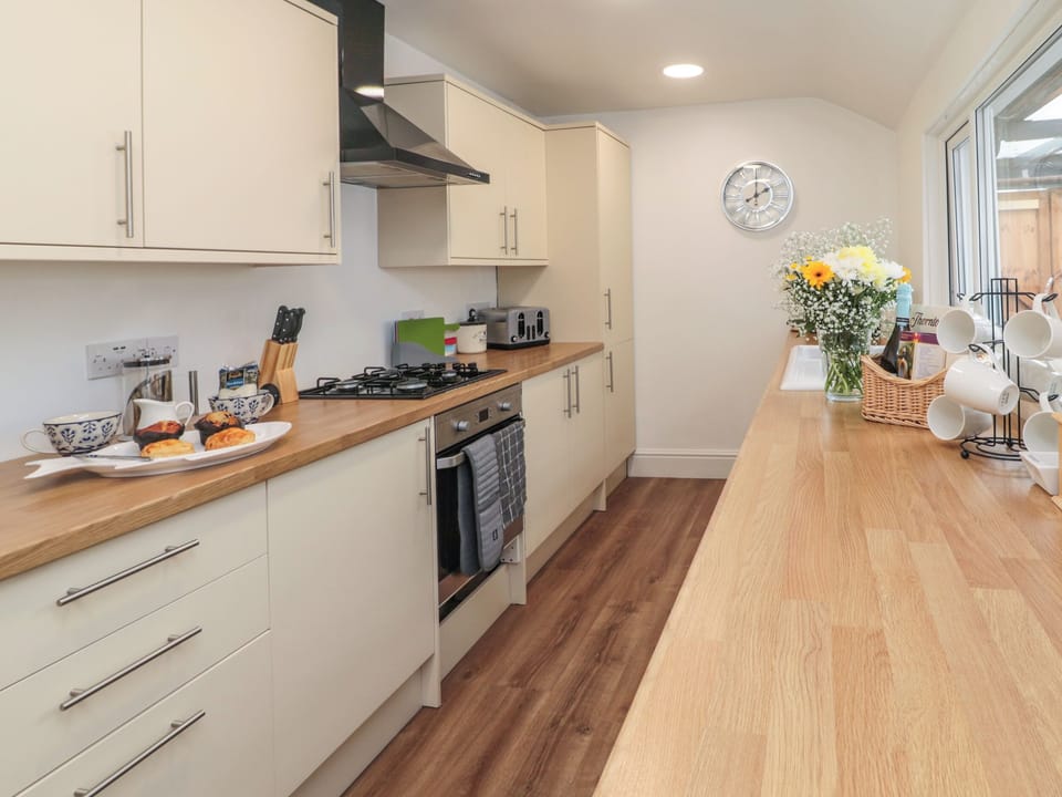 Fridge, electric kettle, toaster, cookware/dishes/utensils