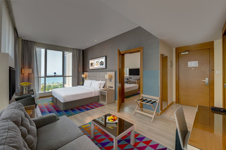 Family Room, Multiple Beds (4 Twin beds) | Minibar, in-room safe, desk, iron/ironing board