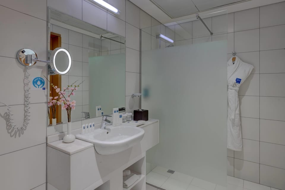 Shower, eco-friendly toiletries, hair dryer, bathrobes