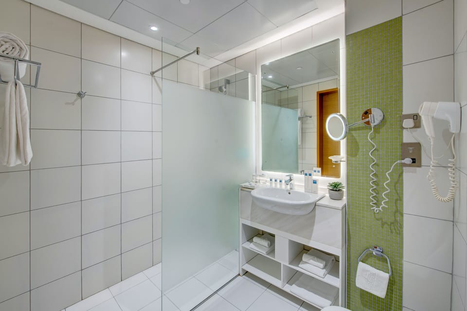 Shower, eco-friendly toiletries, hair dryer, bathrobes