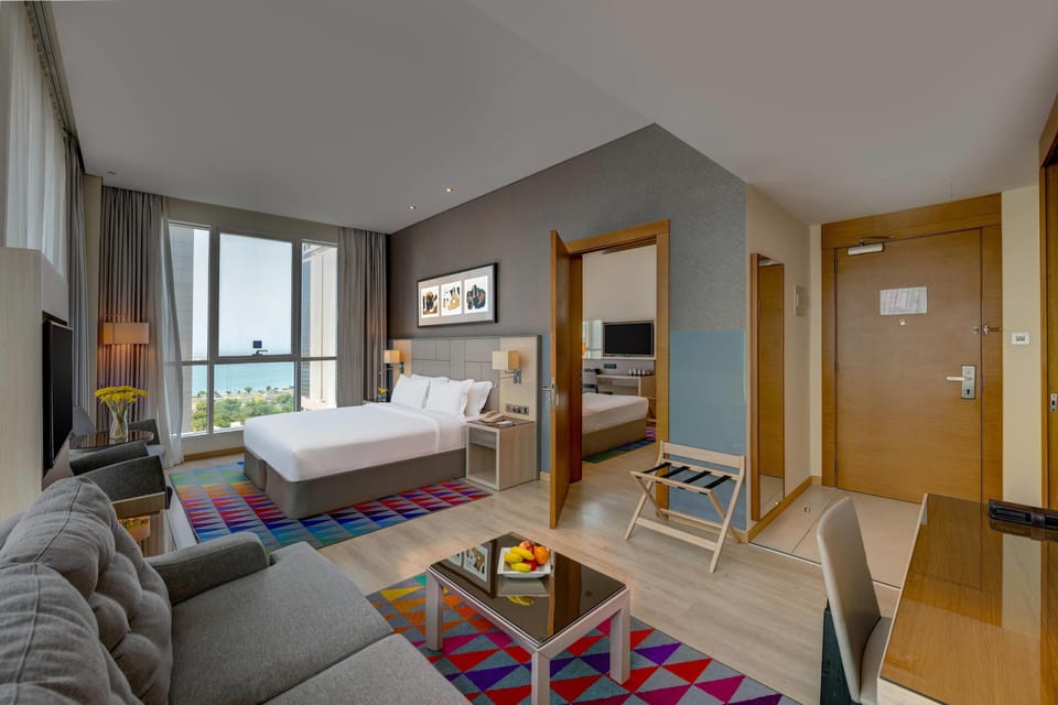 Family Room, Multiple Beds (4 Twin beds) | Minibar, in-room safe, desk, iron/ironing board