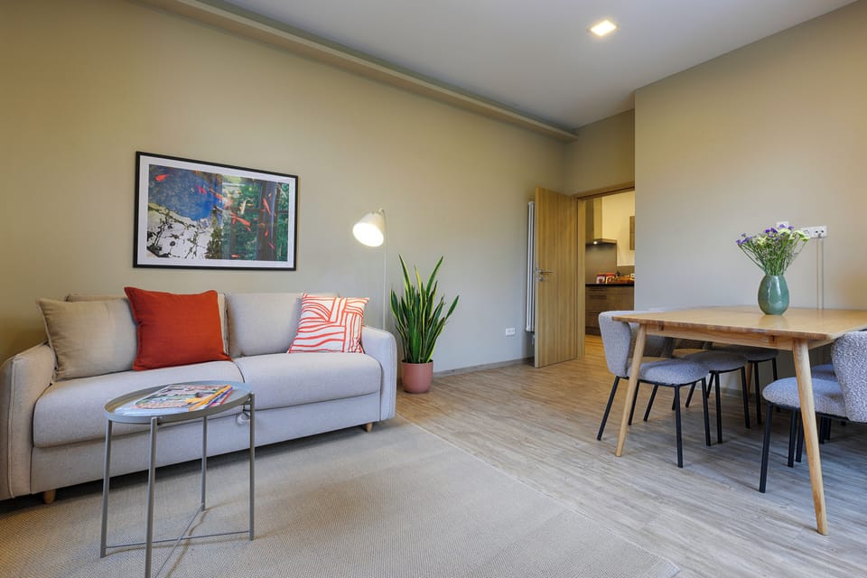 Deluxe Apartment | Living area | 45-inch Smart TV with cable channels