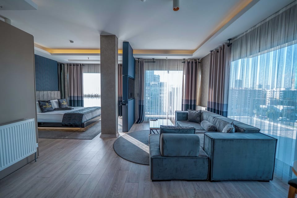 Deluxe Suite | Premium bedding, minibar, desk, laptop workspace