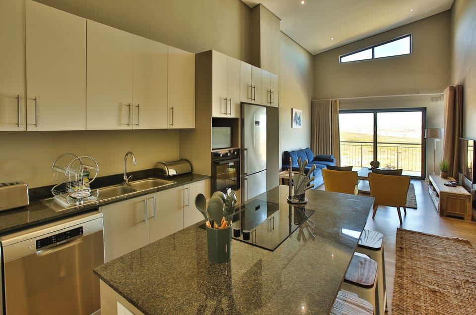 Elite Apartment | Living area | 42-inch flat-screen TV with satellite channels
