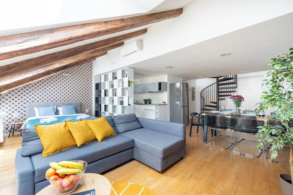 Deluxe Apartment | Living area | 50-inch LED TV with cable channels