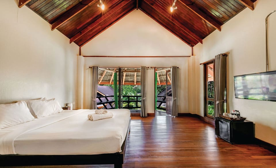 Family Room with Garden View | In-room safe, rollaway beds, free WiFi, bed sheets