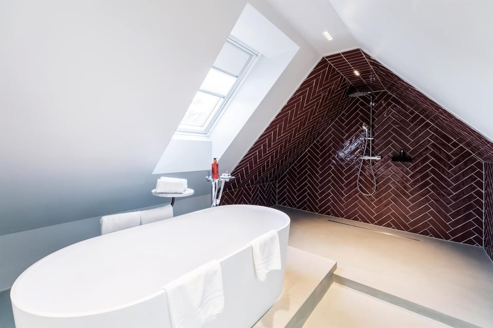 Shower, rainfall showerhead, designer toiletries, hair dryer