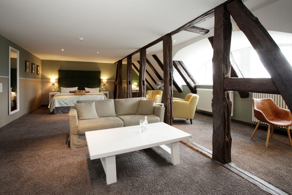 Junior Suite Castle | Living area | 32-inch flat-screen TV with satellite channels, TV, foosball