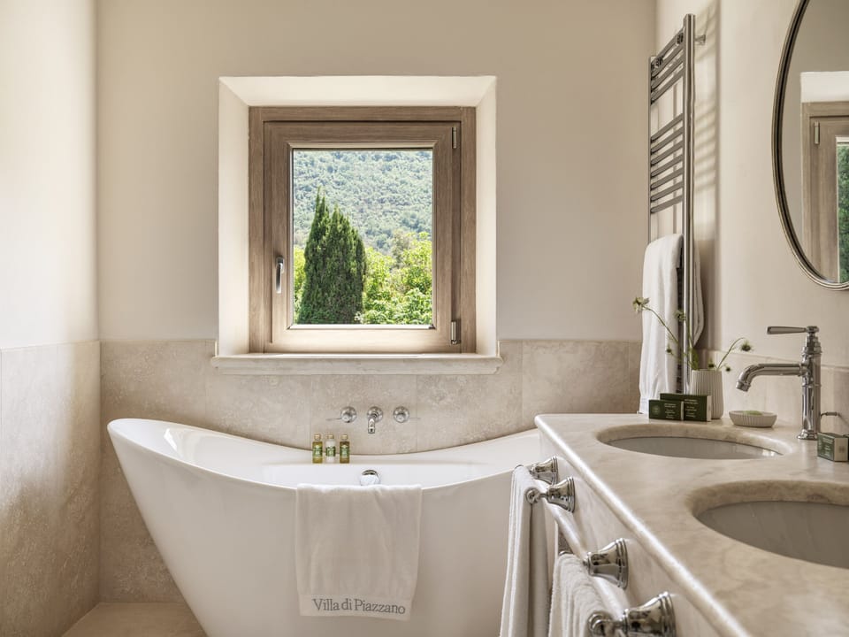 Grand Suite | Bathroom | Designer toiletries, hair dryer, bathrobes, slippers
