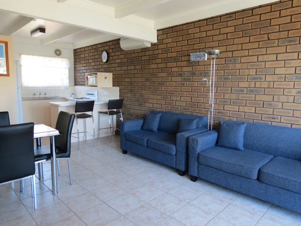 Standard Apartment, 2 Bedrooms, Non Smoking, Kitchen (Pool side) | Living area | 40-inch Smart TV with digital channels, DVD player