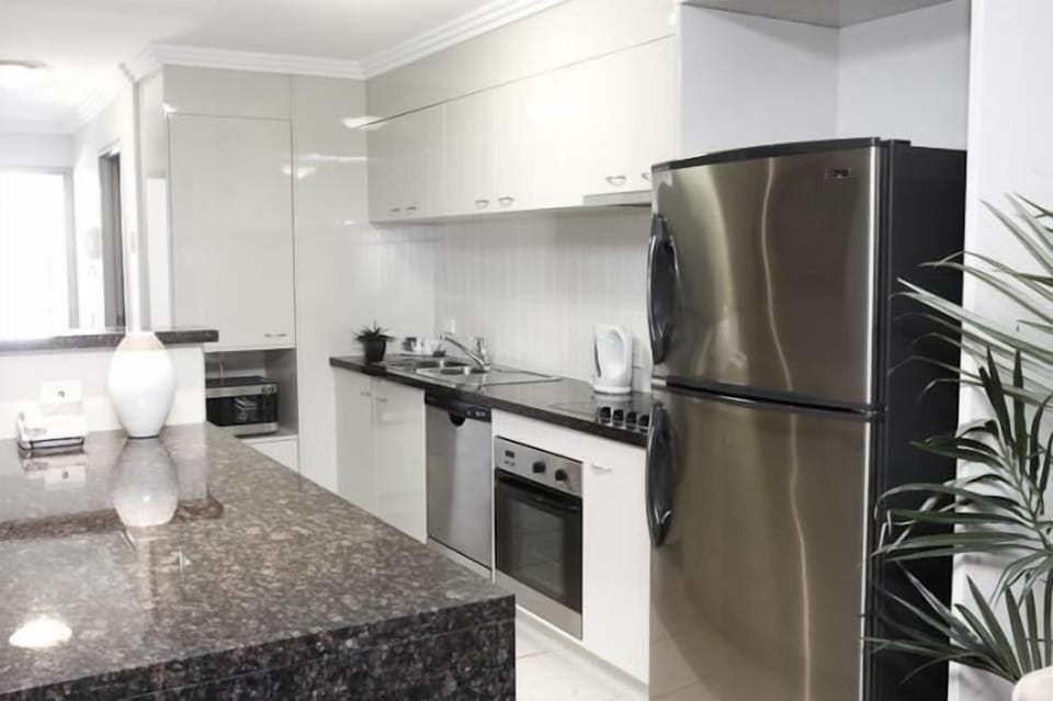 Executive Two Bedroom Ocean Front Apartment | Private kitchen | Coffee/tea maker, full-size fridge, microwave, stovetop