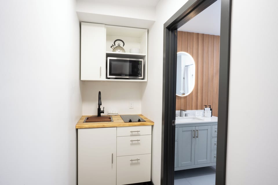 Classic Two Queen Room with Kitchenette | Private kitchenette | Coffee/tea maker, mini-fridge, microwave, stovetop