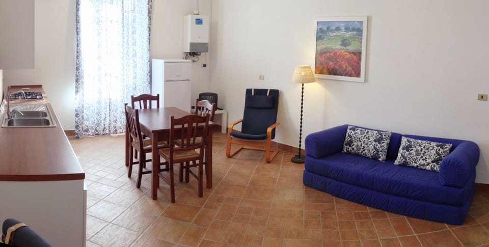 Basic Apartment, Kitchen, Courtyard View | Living room | 24-inch TV with digital channels