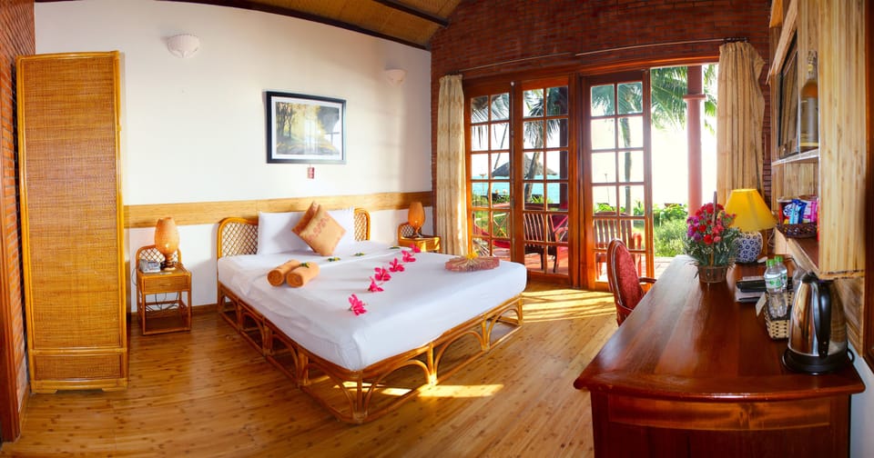 Bungalow, Beachfront | Minibar, in-room safe, desk, blackout drapes