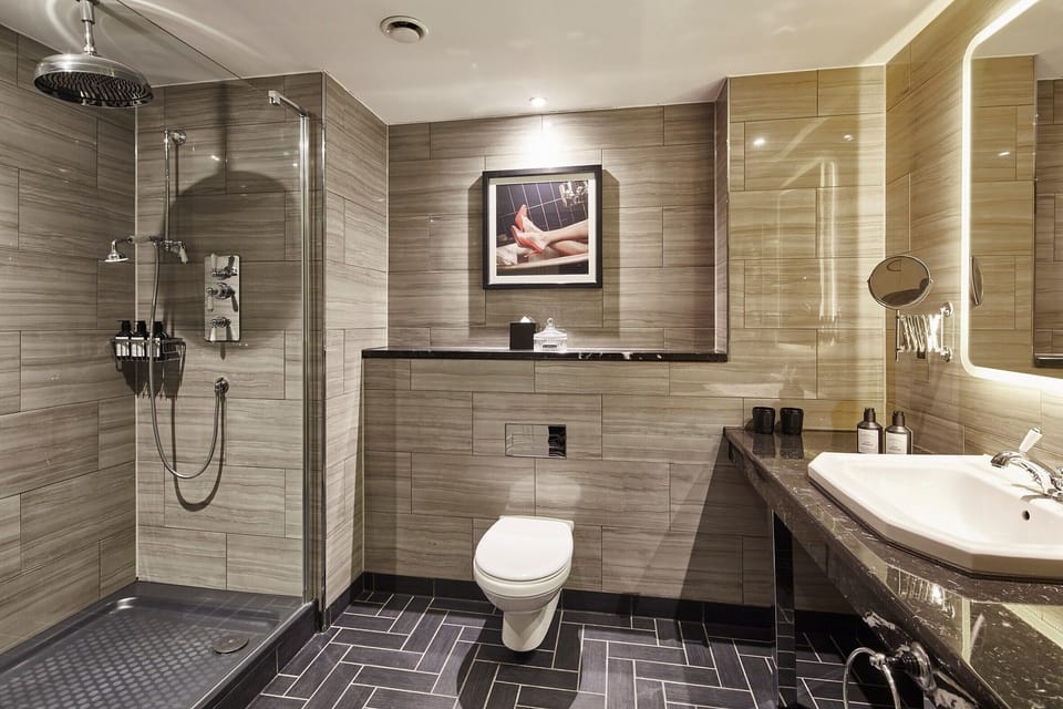 Shower, rainfall showerhead, designer toiletries, hair dryer