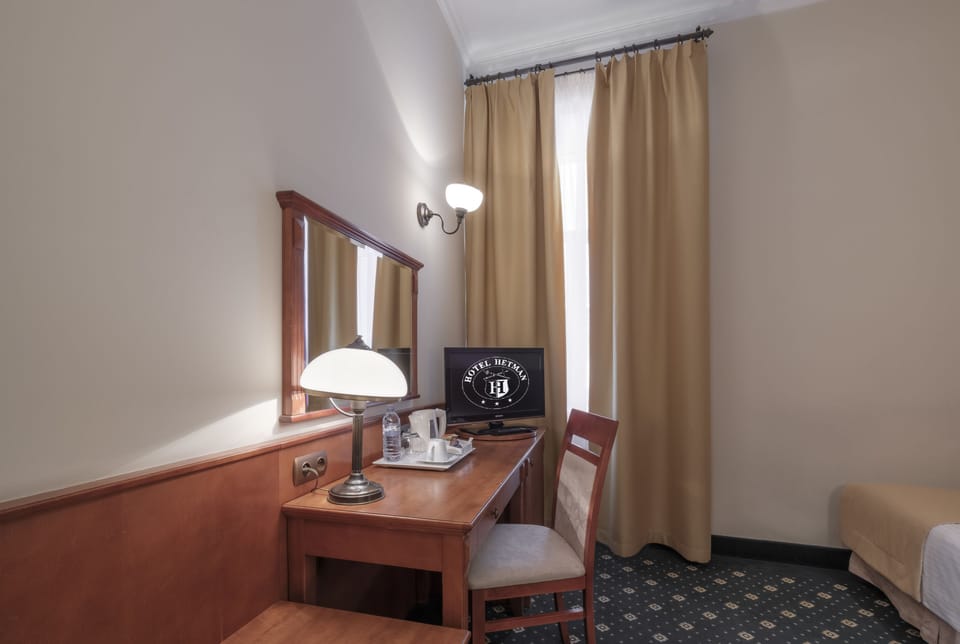 Desk, laptop workspace, WiFi (free), bed sheets